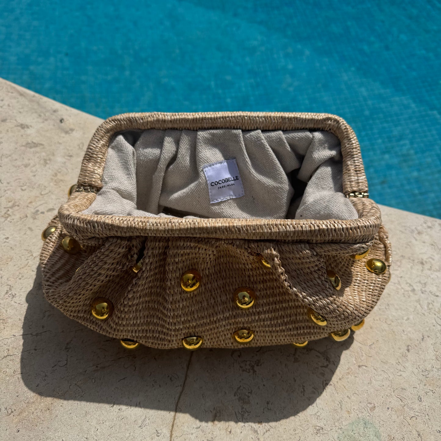 The Maya Clutch Raffia and Eyelet