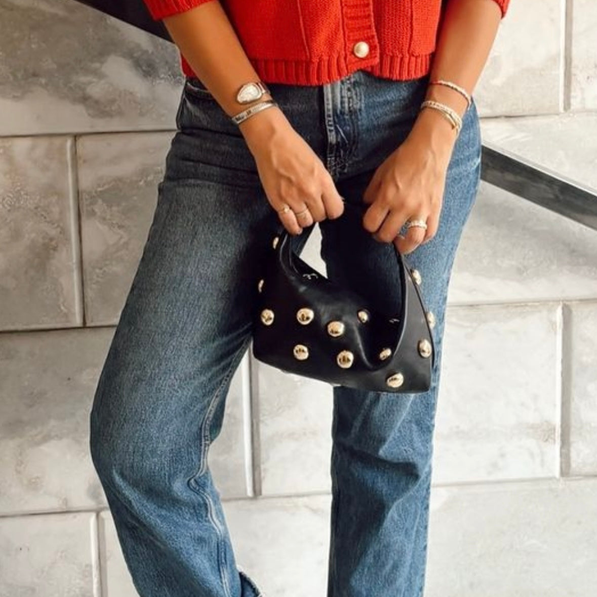 Bric top handle bag in black with silver eyelets by COCOBELLE
