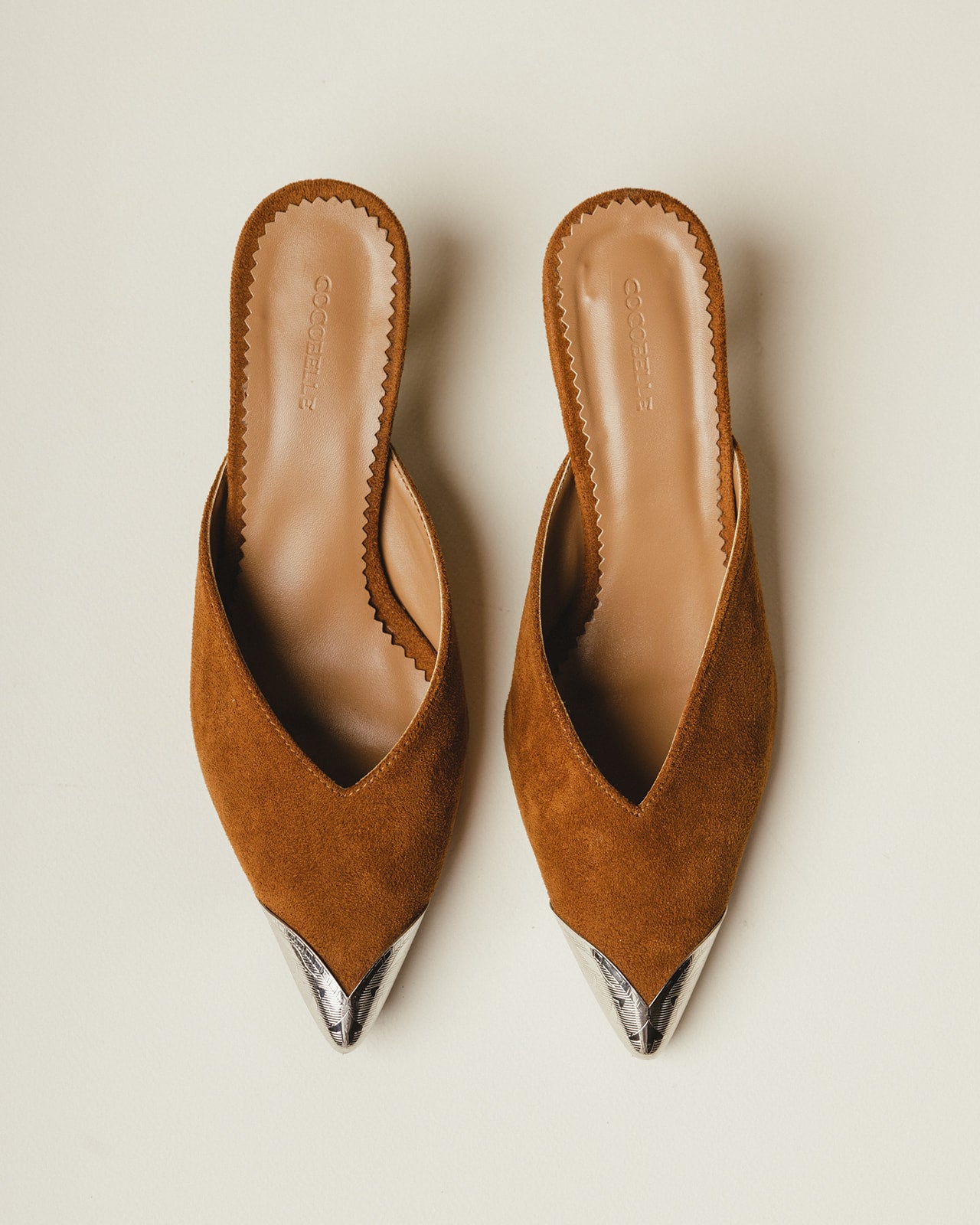 Iconic Metal-Cap Mules in Brown