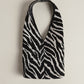 The Demure mini bag in Wild Zebra