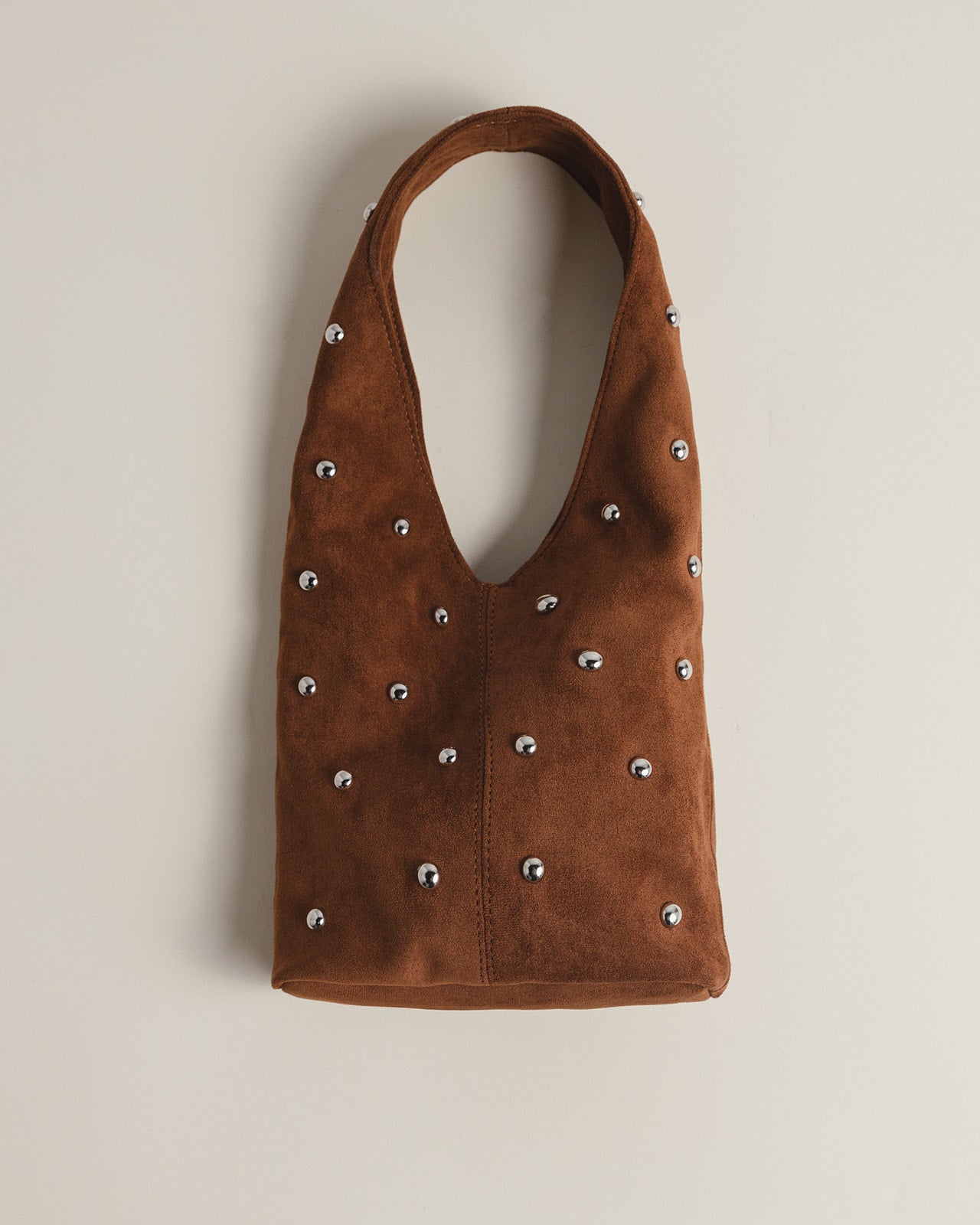 The Demure mini bag in Brown + Silver Eyelets