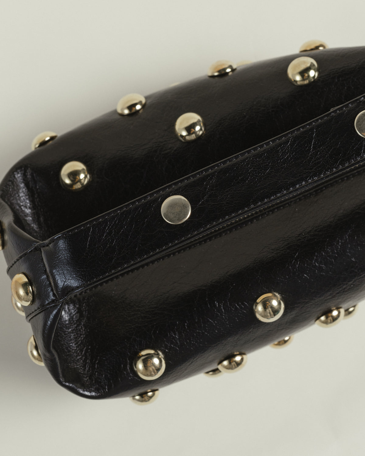 Bric top handle bag in black with silver eyelets by COCOBELLE, view 3