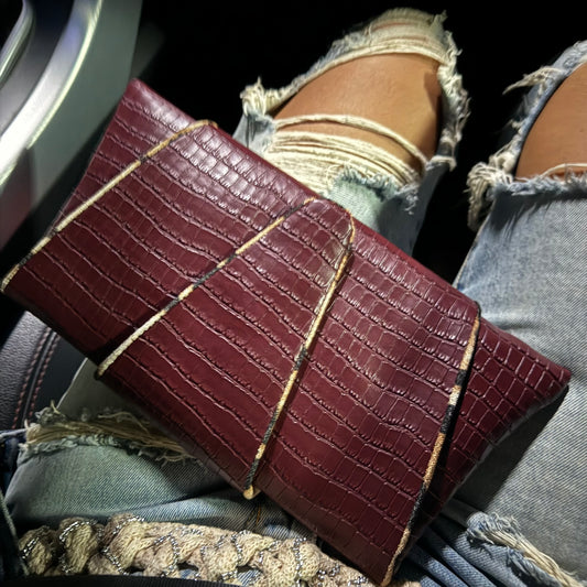 Croissant clutch in burgundy croc by COCOBELLE