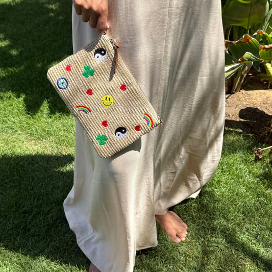 Hippie Funk embroidered raffia pouch and crossbody bag by COCOBELLE