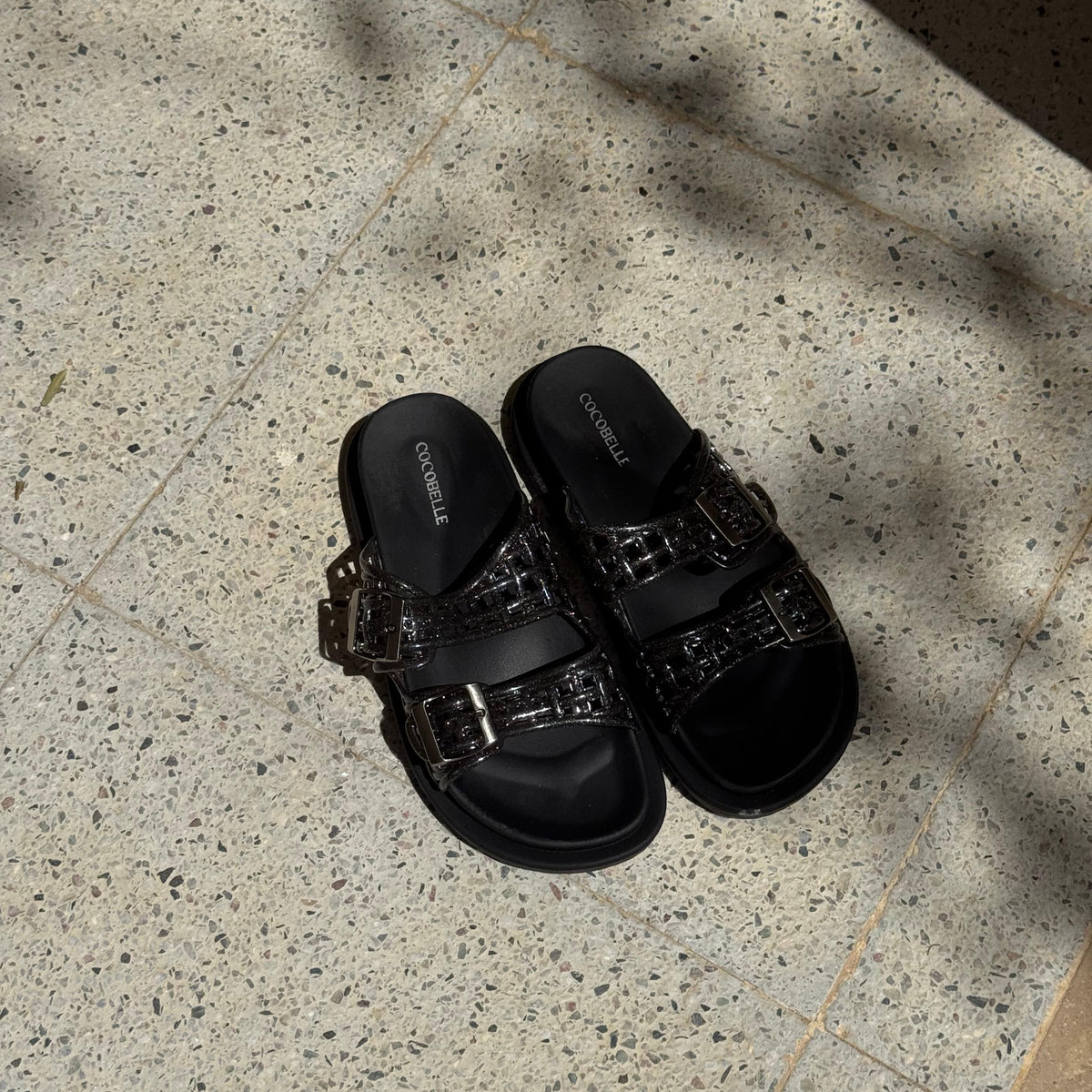 Isabel glitter jelly caged slides in black by COCOBELLE