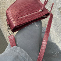 Saddle bag in burgundy croc by COCOBELLE
