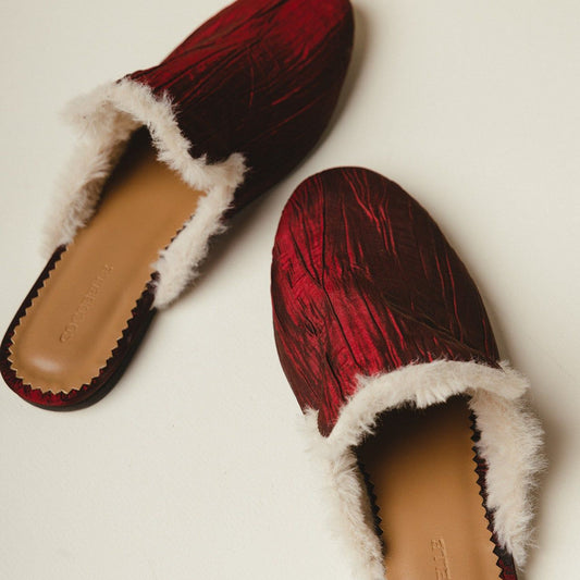 Tracey fur-lined mules in crimson plissé satin by COCOBELLE